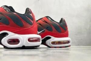 Nike Air Max Plus red black white synthetic mesh sneakers with visible air cushioning soles