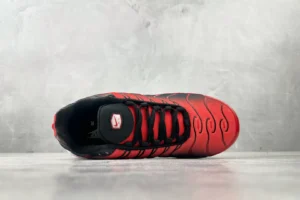 Nike Air Max Plus TN Red Black textile sneakers with black lace-up and signature wave design