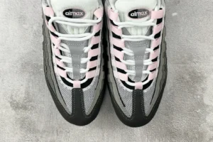 Nike Air Max 95 Grey Pink sneakers featuring a grey and black design with pink accents, showcasing the lacing and air cushioning details.