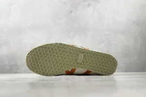 Onitsuka Tiger Mexico 66 beige orange leather sneakers with textured rubber sole viewed from bottom