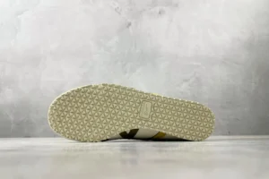 Onitsuka Tiger Mexico 66 sneakers white yellow leather with beige patterned rubber sole visible from bottom view