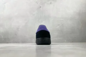 Puma Suede Classic black purple suede sneakers with textured rubber sole back view