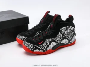 Nike Air Foamposite One black white red synthetic sneakers with bold graphic pattern and red outsole