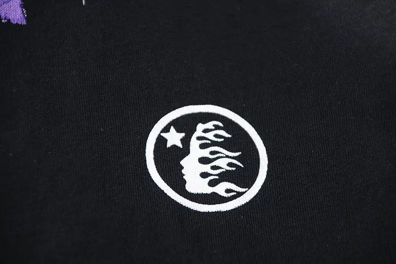 Repsgoat cotton black t-shirt with white circular flame face and star graphic design