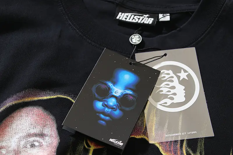HeliStar graphic t-shirt black cotton with printed tags featuring blue face and logo designs