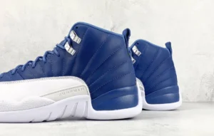 Air Jordan 12 Retro French Blue white leather sneakers with metallic eyelets and rubber sole