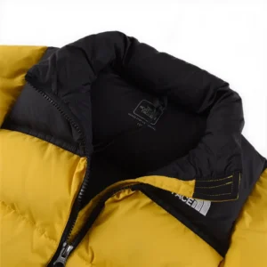 The North Face insulated puffer jacket yellow black synthetic fabric winter coat