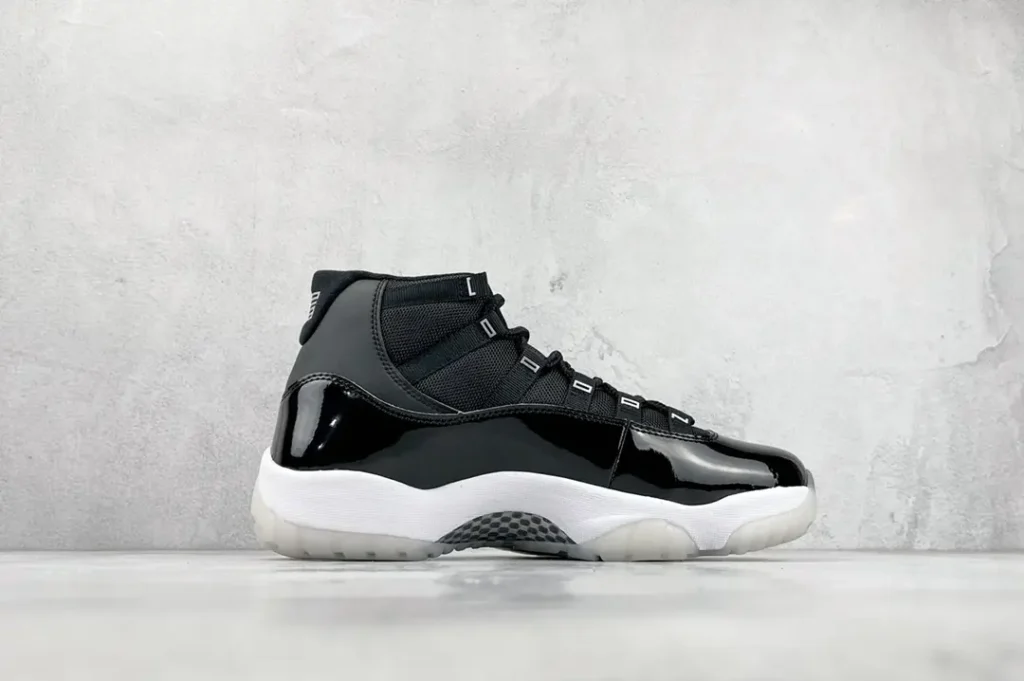Nike Air Jordan 11 Retro Concord white black patent leather sneakers with mesh upper and translucent sole