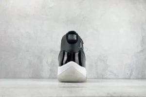 Nike Air Jordan 11 Concord black white patent leather sneakers rear view on concrete background