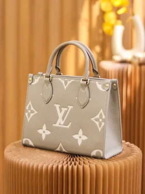 Louis Vuitton OnTheGo GM large taupe white monogram embossed leather tote bag