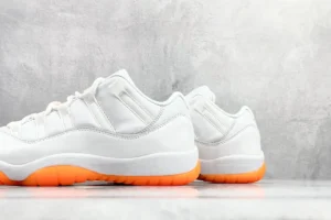 Nike Air Jordan 11 Low white orange colorway leather sneakers with bright orange sole rubber outsole