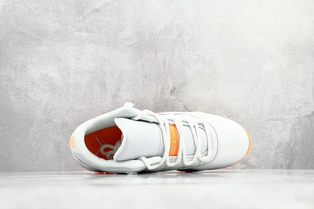 Air Jordan 11 Low white orange leather sneakers with mesh detailing and rubber sole