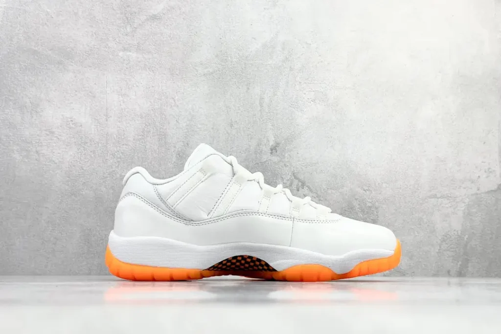 Nike Air Jordan 11 Retro Low white orange leather sneakers with carbon fiber detailing