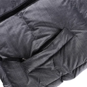 Children's North Face down jacket featuring a lightweight design and a zippered pocket, showcasing warmth and durability for stylish kids' outerwear.