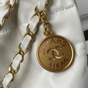 Chanel handbag gold chain leather strap white soft leather with round gold logo charm Paris engraving