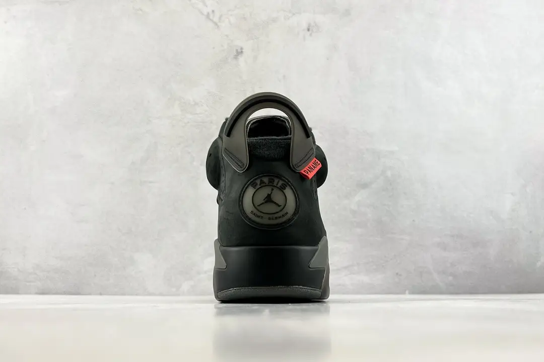 Air Jordan 6 Retro PSG black dark grey suede sneakers with Paris Saint-Germain logo and red tag detail
