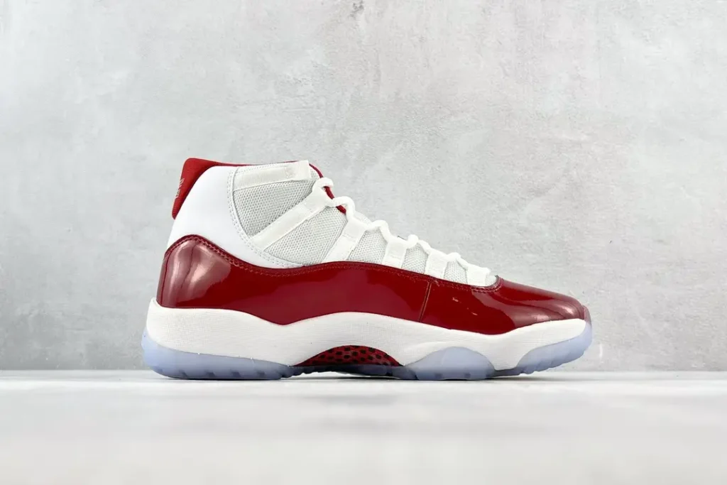 Nike Air Jordan 11 Retro cherry red white black patent leather sneakers with icy sole