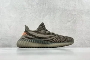 Adidas Yeezy Boost 350 V2 earth brown primeknit sneakers with semi-translucent rubber sole and orange accent