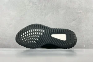 Adidas Yeezy Boost 350 V2 black white rubber sole sneakers showing tread pattern and boost technology