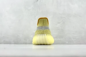 Adidas Yeezy Boost 350 V2 Antlia yellow reflective knit sneakers with ribbed translucent sole