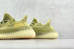 Adidas Yeezy Boost 350 V2 Sulfur yellow Primeknit sneakers with translucent rubber sole