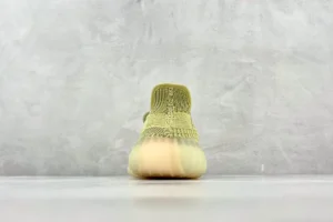 Adidas Yeezy Boost 350 V2 Sulfur yellow Primeknit knit sneakers with ribbed translucent sole