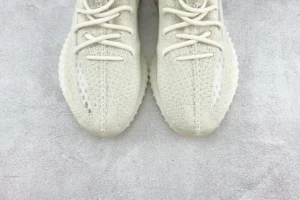 Adidas Yeezy Boost 350 V2 cream white knit sneakers with translucent stripe and ribbed sole rubber material