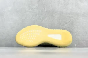 Adidas Yeezy Boost 350 V2 yellow rubber sole knit sneaker outsole close-up material texture