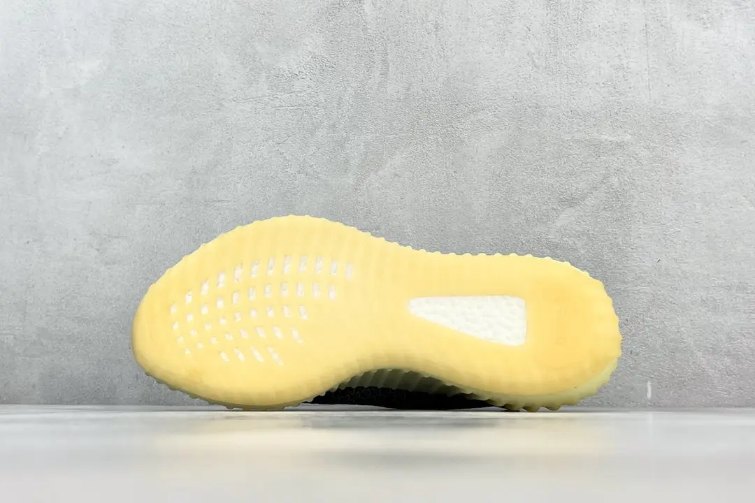 Adidas Yeezy Boost 350 V2 yellow rubber sole knit sneaker outsole close-up material texture