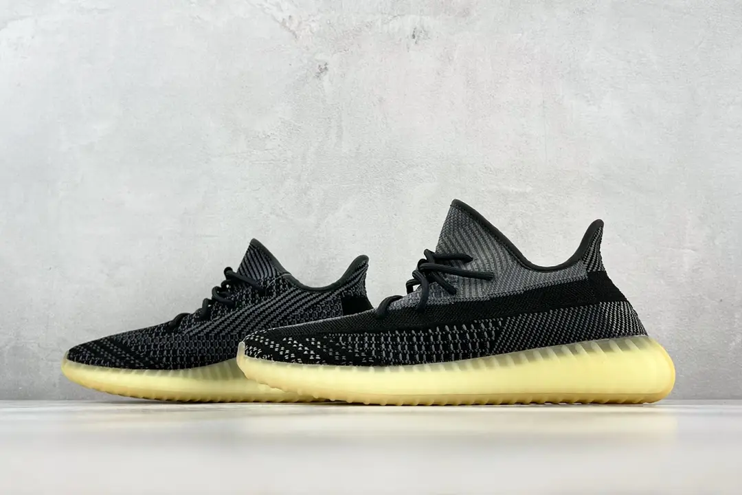 Adidas Yeezy Boost 350 V2 charcoal black gray Primeknit sneakers with semi-translucent yellow sole