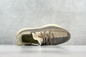 Adidas Yeezy Boost 350 V2 earth beige brown knit sneakers with ribbed sole and lace-up design