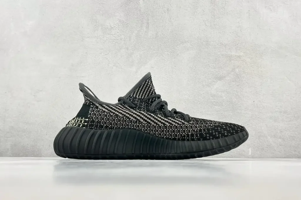 Adidas Yeezy Boost 350 V2 black and white Primeknit sneakers with black ribbed rubber sole