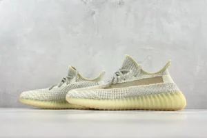 Adidas Yeezy Boost 350 V2 Lundmark colorway knit fabric sneakers with translucent stripe and ribbed sole