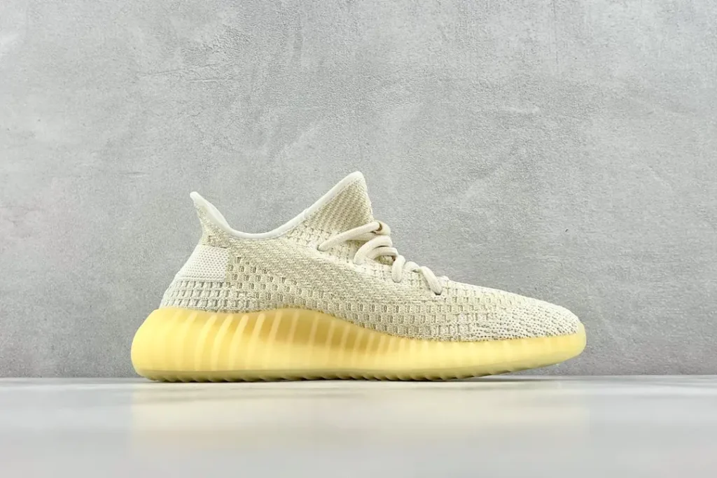 Adidas Yeezy Boost 350 V2 butter cream yellow Primeknit sneakers with ribbed rubber sole