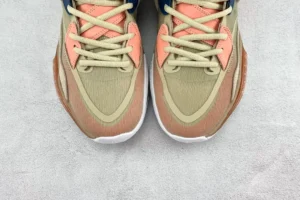 Nike Kyrie 8 Infinity EP replica sneakers featuring a blend of beige and coral colors, showcasing intricate lacing and textured materials.