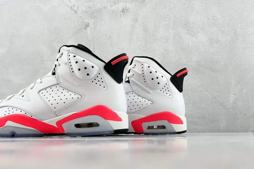 Nike Air Jordan 6 Retro White Infrared leather sneakers with visible air sole and perforated panels