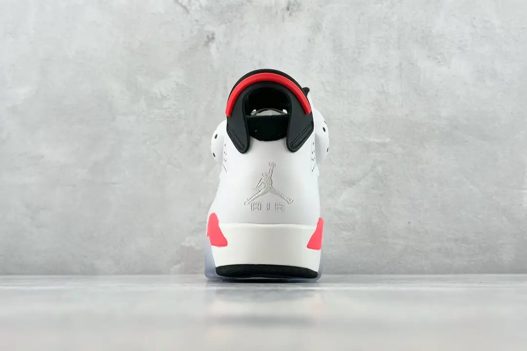 Nike Air Jordan 6 Retro white infrared black leather sneakers rear view on gray background