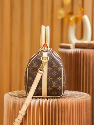 Louis Vuitton Speedy 25 M41526 monogram canvas handbag with beige leather straps and gold hardware