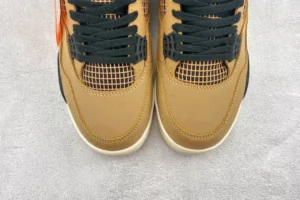 Nike Air Jordan 4 Retro Wheat brown nubuck sneakers with black accents and mesh detailing