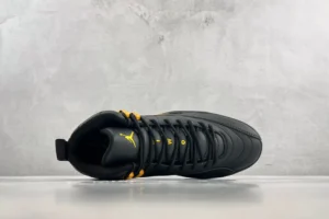 Nike Air Jordan 12 Retro black university gold leather sneakers with stitched design and padded collar