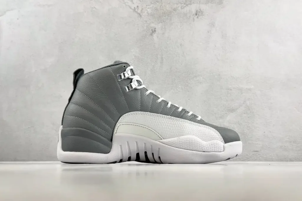 Nike Air Jordan 12 Retro Cool Grey white gray leather sneakers with metal eyelets and rubber sole