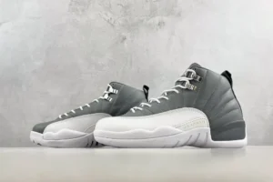 Air Jordan 12 Retro Dark Grey White leather sneakers with metallic eyelets and rubber sole