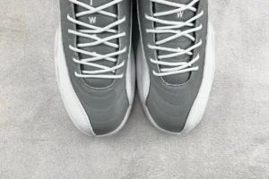 Air Jordan 12 Retro Cool Grey white and grey leather sneakers with detailed stitching and white laces