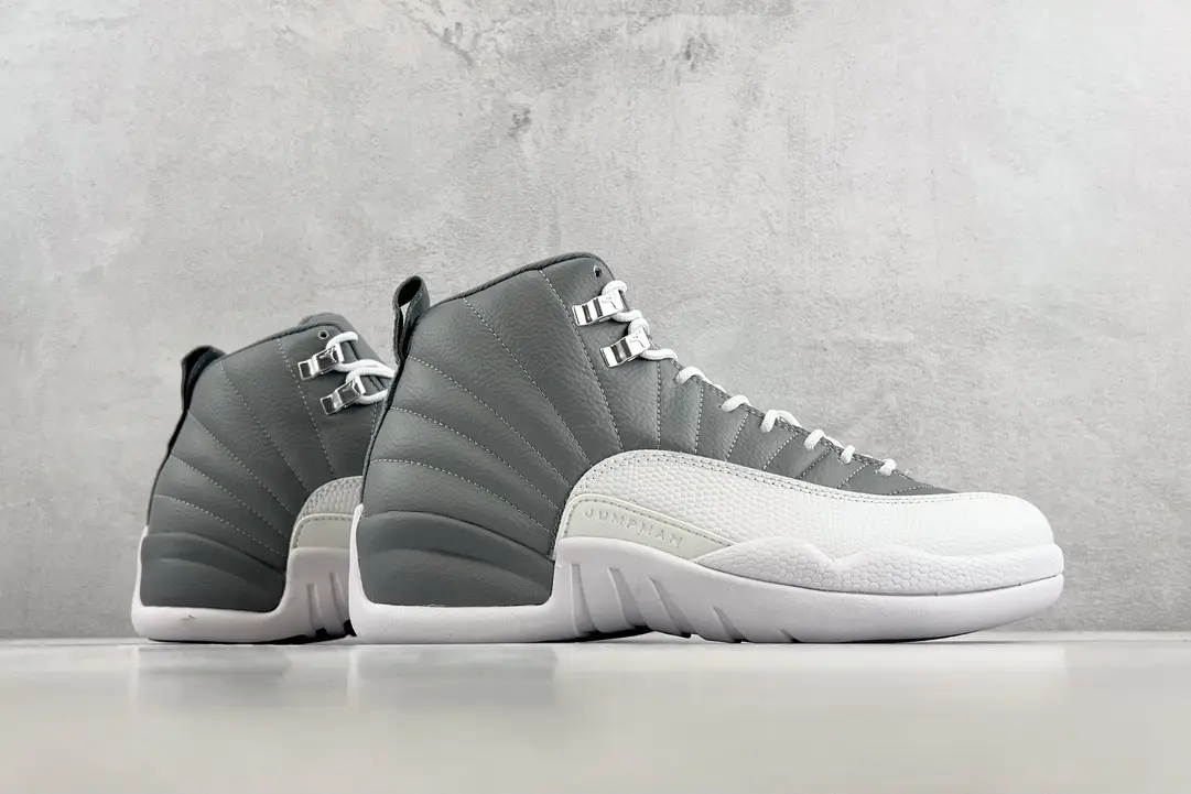Air Jordan 12 Retro Cool Grey white and grey leather sneakers with metallic eyelets and rubber sole