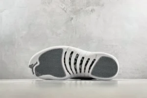 Nike Air Jordan 12 Retro white varsity red black leather sneakers with rubber sole and carbon fiber details