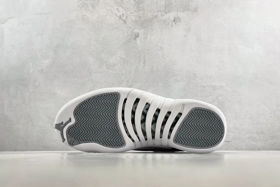 Nike Air Jordan 12 Retro white varsity red black leather sneakers with rubber sole and carbon fiber details