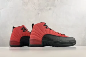 Jordan 12 Retro Flu Game sneakers in red and black, displayed from the side on a neutral background, highlighting their premium design and details.