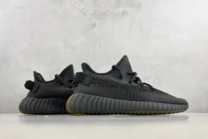 Adidas Yeezy Boost 350 V2 black colorway Primeknit fabric sneakers with gum sole outsole