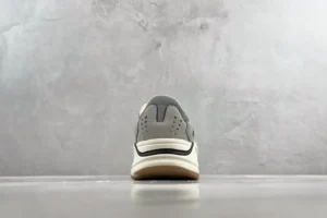 Nike Air Max 1 grey ivory light suede and mesh sneakers with gum sole visible from rear view