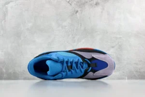 Adidas Yeezy Boost 700 Bright Blue Grey Black suede mesh sneakers with orange accents